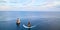 Panoramic view of ocean and floating yachts. Blue sky and seascape. Nature landscape and water texture idea, copy space