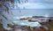 Panoramic view of the ocean and rocky shore near Spouting Horn blowhole, Pacific Ocean, Kauai, Hawaii, USA