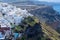 Panoramic view of Oia town cityscape at Santorini island in Greece. Traditional white houses. Greece, Aegean sea. Famous European