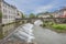 Panoramic view of the old bridge that crosses the river Salat and dams on its way through the village of Saint Girons. Ariege