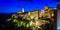 Panoramic view of an old town Pitigliano at the dusk, small old town in Maremma Region in Tuscany, Italy
