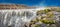Panoramic view over biggest and most powerful waterfall in Europe called Dettifoss in Iceland, near lake Myvatn, at blue sky,