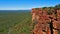 Panoramic view over the bush covered Kalahari desert from the ridge of red colored rocks of Waterberg Plateau, Namibia, Africa.