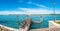 Panoramic view over busy Grand Canal and pier, promenade embankment at Lido island in Venice, Italy