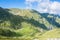 Panoramic view over the Carpatian mountains, green valleys and b