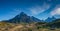 Panoramic view over magical mountain peaks standing high towers teeth surrounded by wet austral forests in Torres del Paine