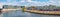 Panoramic view over relaxing people at the cafe Capital Beach at Spree channel, Spreebogen, with a tour boat in historical and