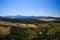 Panoramic view over rural wide valley contrasting with cloudless blue sky from ancient village Ronda - Andalusia, Spain