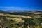 Panoramic view over rural wide valley contrasting with cloudless blue sky from ancient village Ronda - Andalusia, Spain