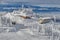 Panoramic view over the ski slope Poiana Brasov ski resort in Transylvania, Pine forest covered in snow on winter season,Mountain