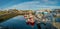 Panoramic view over sunset at Stykkisholmur Stykkish downtown and harbor with many fish restaurants, yachts, boats and a