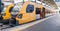 Panoramic view of pair of local yellow trains at Sao Bento station, Porto, Portugal