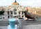 Panoramic view of the palace of fine arts in mexico city with bird, coffee and blue drink in the foreground