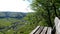 Panoramic view of a park bench to the Swabian Alb mountains