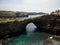 Panoramic view of Pasih Uug Broken beach tropical rock arch tunnel cliff cove natural bridge Nusa Penida Bali Indonesia