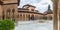 Panoramic view at the Patio at the Lions, twelve marble lions fountain on Palace of the Lions or Harem, Alhambra citadel, tourist