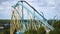 Panoramic view of people enjoying Kraken and Mako rollercoaster at Seaworld . Fast Camera.