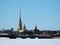 Panoramic view of the Peter and Paul Fortress beyond the Trinity Bridge over the frozen river