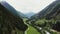 Panoramic view of a picturesque mountain valley with a village in a lowland