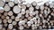 Panoramic view of pile of lumber covered in snow on winter day