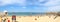 Panoramic View of Playa La Caleta Beach at Cadiz, Andalusia. Spain.  Unrecognizable Beach Goers and Swimmers.  Slight Barrel Disto