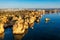 Panoramic view, Ponta da Piedade near Lagos in Algarve, Portugal. Cliff rocks and tourist boat on sea at Ponta da Piedade, Algarve