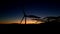 Panoramic view of a power generating wind farm during sunset