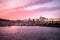 Panoramic View of Prague Castle, Charles Bridge and St Vitus Cathedral reflected in the Vltava river at dusk