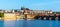 Panoramic view of Prague Castle and Charles Bridge on sunny spring morning, Praha, Czech Republic