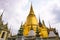 Panoramic view of the Prasat Phra Thep Bidon and the Golden Chedi in Wat Phra Kaew Complex. Bangkok, Thailand.