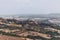 Panoramic view of the province of Tuscany with the city Castiglione d`Orcia on top of the hill and the tower Rocca di Tentennano.