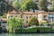Panoramic view of quaint traditional waterfront houses on majestic Lake Como, Lombardy, Italy.