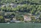 Panoramic view of quaint traditional waterfront houses on majestic Lake Como, Lombardy, Italy.