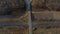 Panoramic View of Railroad Crossing Between Trees in Fields Aerial Drone View