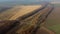 Panoramic View of Railroad Crossing Between Trees in Fields on Autumn Day