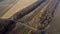 Panoramic View of Railroad Crossing Between Trees Fields Autumn Day Aerial Drone