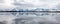 Panoramic View of Reflection of Mountain Range in Lake at Grand Tetons National Park in Wyoming, USA