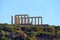 Panoramic view of the remains of a Greek temple dedicated to Poseidon, on the cape of Cape Sunio, located on the southern tip of