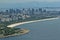 Panoramic view of Rio de Janeiro and Flamengo beach with airplane coming to airport Santos Dumont
