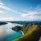 Panoramic view river, hills. Aerial drone shot. Indonesia. Spectacular landscape of Sumba island. Blue sky