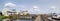 Panoramic view of riverfront homes and boats along the boardwalk in Washington NC