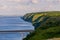 Panoramic view of the road bridge over big river and hills, slopes, steppe coast, gully, ravine on a banks