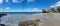 Panoramic view of rocks formation on Thomson Bay beach in Rottnest Island, Australia with blue sky