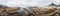 Panoramic view of rocky channels on Camps bay beach in cape town, south Africa at sunset