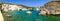 Panoramic view of rocky coastline and turqouise water, Milos, Gr