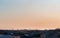 Panoramic view of the roofs, towers, domes of churches and cathedrals in sunset light on the spring evening. Saint