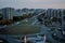 Panoramic view of the roundabout at the intersection of four streets in an early autumn morning from the roof