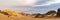 Panoramic view of Sahara Desert sand dune and rocky mountain off road nature.