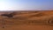 Panoramic view sand dunes and hills in hot desert. Wilderness desert landscape