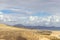 Panoramic view at sandy beach of Risco del Paso on canary island Fuerteventura with  turquoise water and mountain range in the